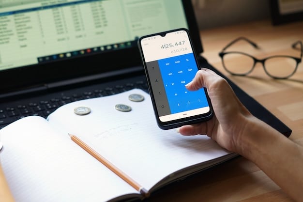 A close-up of a hand using a smartphone displaying a personal loan calculator app. The interface includes sliders and input fields for loan amount, interest rate and term length.