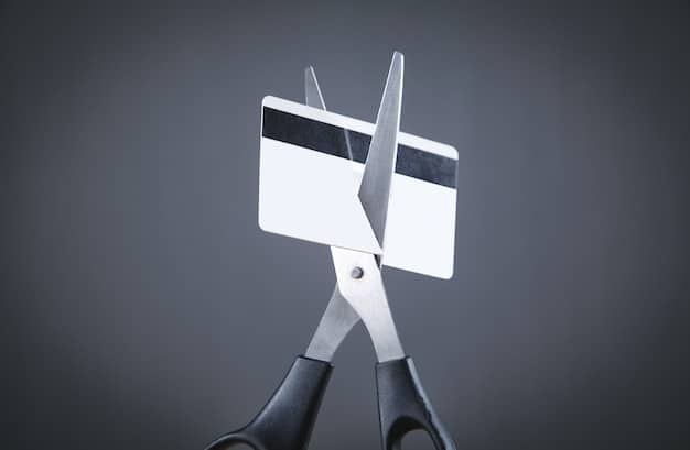 A person cutting up credit cards with scissors, symbolizing debt reduction. The background shows a stack of bills with crossed-out amounts.