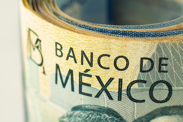 A close-up shot of Mexican peso banknotes carefully stacked together, representing a growing emergency fund and financial security.