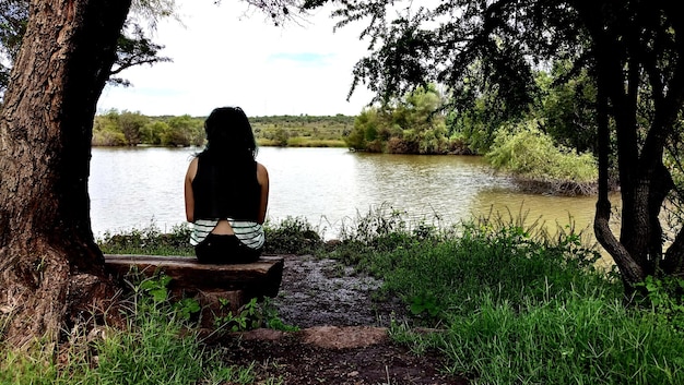 A person practicing mindful meditation in a peaceful garden in Mexico, surrounded by nature and expressing gratitude for the present moment. The image should highlight the connection between mindfulness, gratitude, and the beauty of Mexican nature.