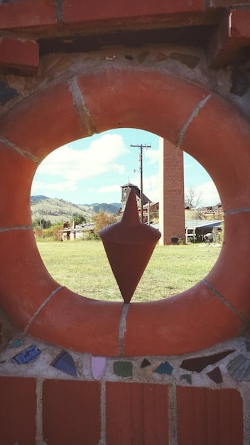 A close-up photo of a labyrinth with a miniature Mexican flag placed at the center, symbolizing the complexities and challenges of personal growth in Mexico.