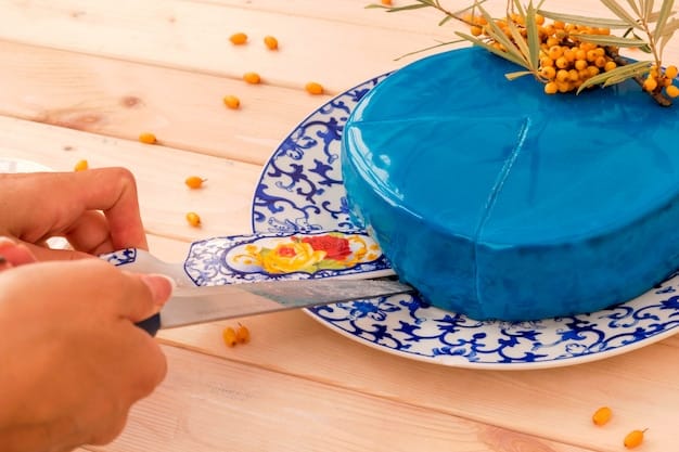 Hands carefully placing small pieces of colorful talavera tiles onto a terracotta pot, adhering them with a light-colored adhesive. The partial completion of the mosaic reveals a detailed floral pattern, with various hues of blue, yellow, and orange creating a vibrant design.
