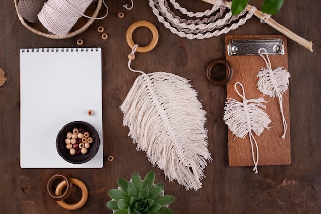 An aerial view of various dreamcatcher craft supplies laid out on a wooden table, including different sizes of hoops, colorful threads, an assortment of natural feathers, and a selection of beads. The arrangement is neat and organized, suggesting the beginning of a dreamcatcher crafting project.