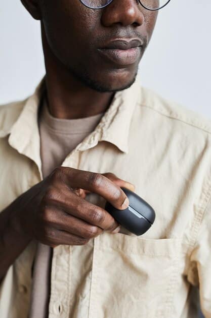 A person carefully placing wireless earbuds into their charging case, showcasing the importance of proper storage and protection.