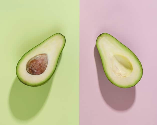 A cut avocado half with browning on the surface, compared to a vibrant green avocado half that has been protected from oxidation. Focus on the color difference and the visible contrast.