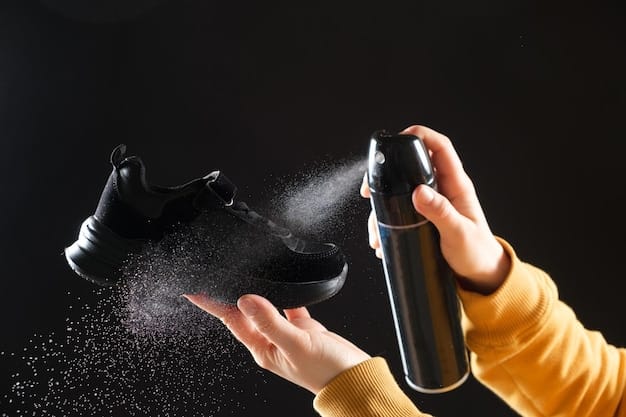 A close-up shot of a person's hand pouring baking soda into a shoe. The shoe is a dark color and the baking soda is white. The background is blurred.