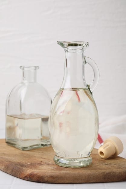 An image showing a close-up of a bottle of white vinegar beside a disassembled showerhead, with clear instructions on how to dilute the vinegar for soaking.